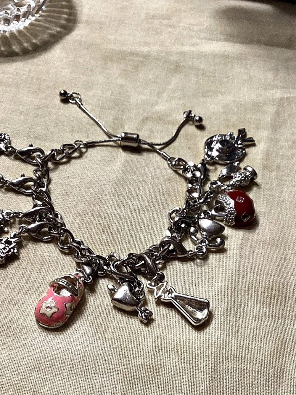 NWOT. Adjustable Silvertone Charm Bracelet